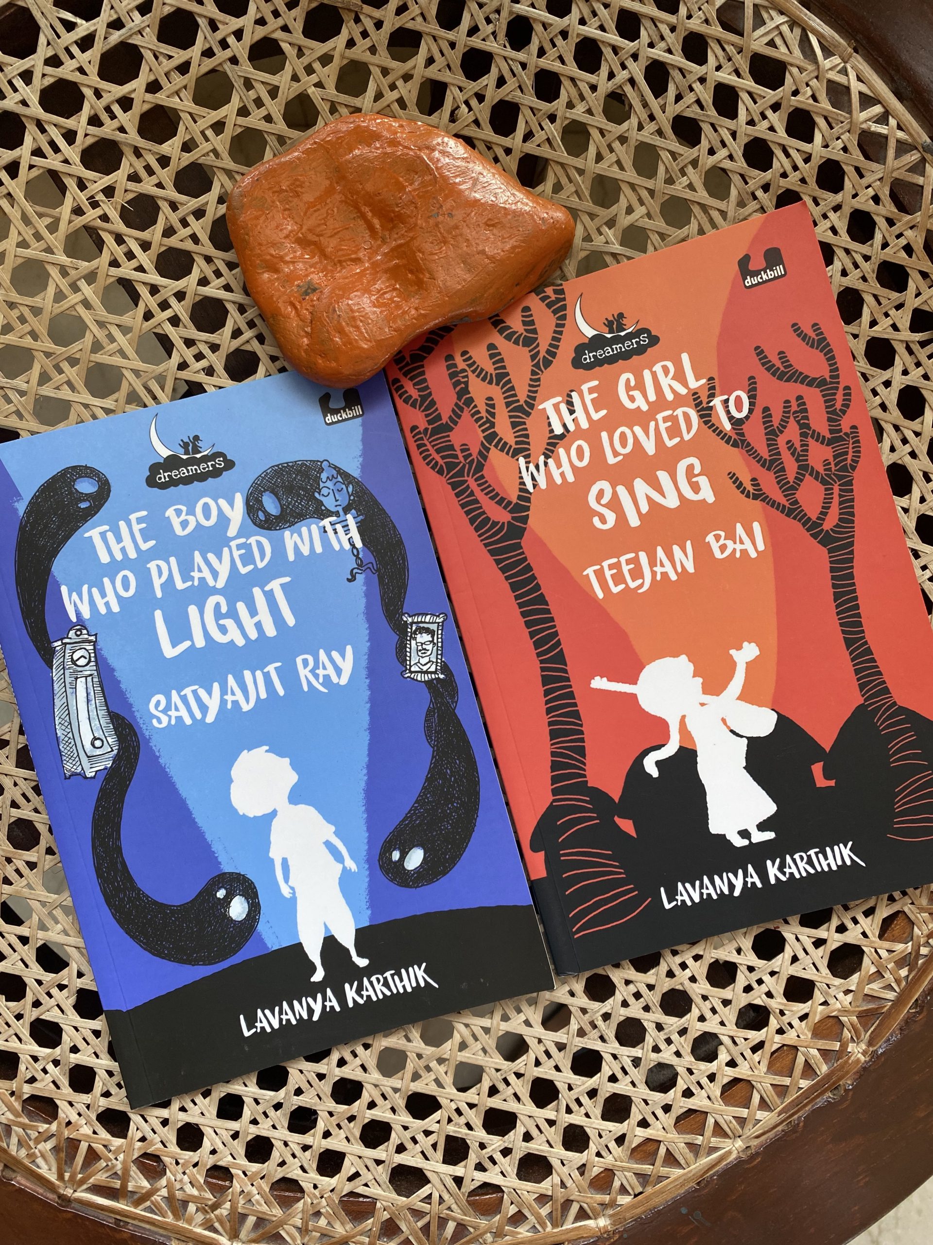 Two books: The Boy Who Played with Light- Satyajit Ray and The Girl Who Loved to Sing- Teejan Bai, both written by Lavanya Karthik, published by duckbill (Penguin) spin a tale of dreams and dreamers.